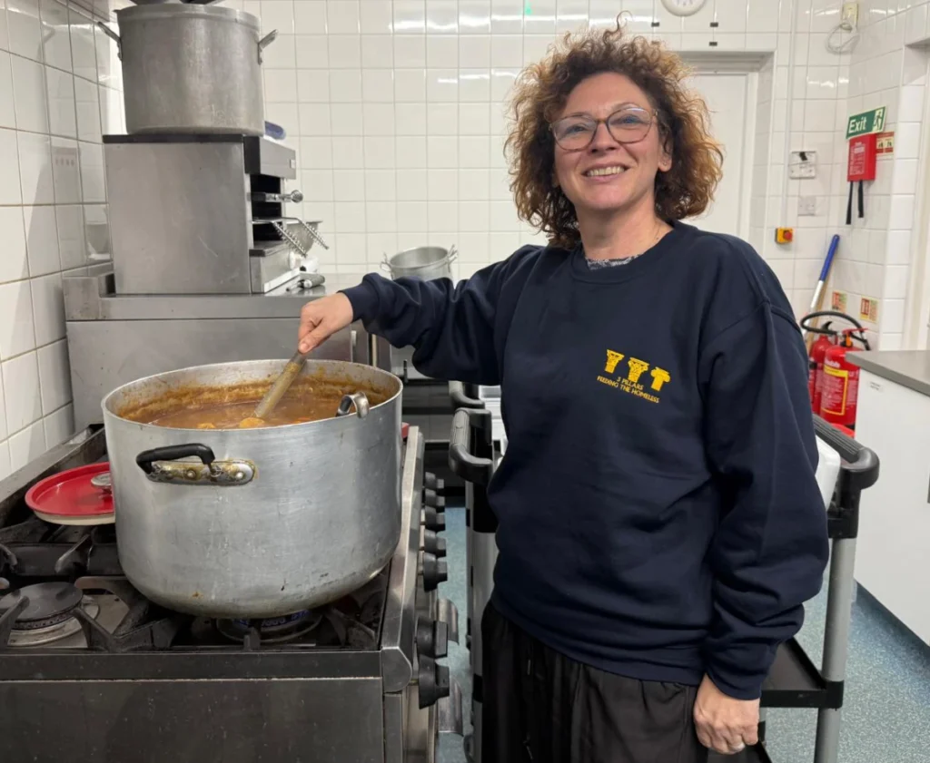 Volunteer preparing fresh hot meals for 3 Pillars Dunstable outreach